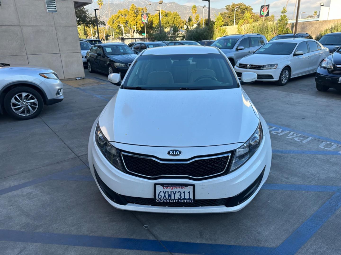 2013 WHITE Kia Optima (5XXGM4A72DG) , AUTOMATIC transmission, located at 30 S. Berkeley Avenue, Pasadena, CA, 91107, (626) 248-7567, 34.145447, -118.109398 - Crown City Motors is a used “Buy Here Pay Here” car dealer in Pasadena CA. “Buy Here Pay Here” financing, means that when you purchase your vehicle from our dealership, that you make the payments to the dealership as well. We do not need the banks approval to get you approved for a used auto - Photo#6